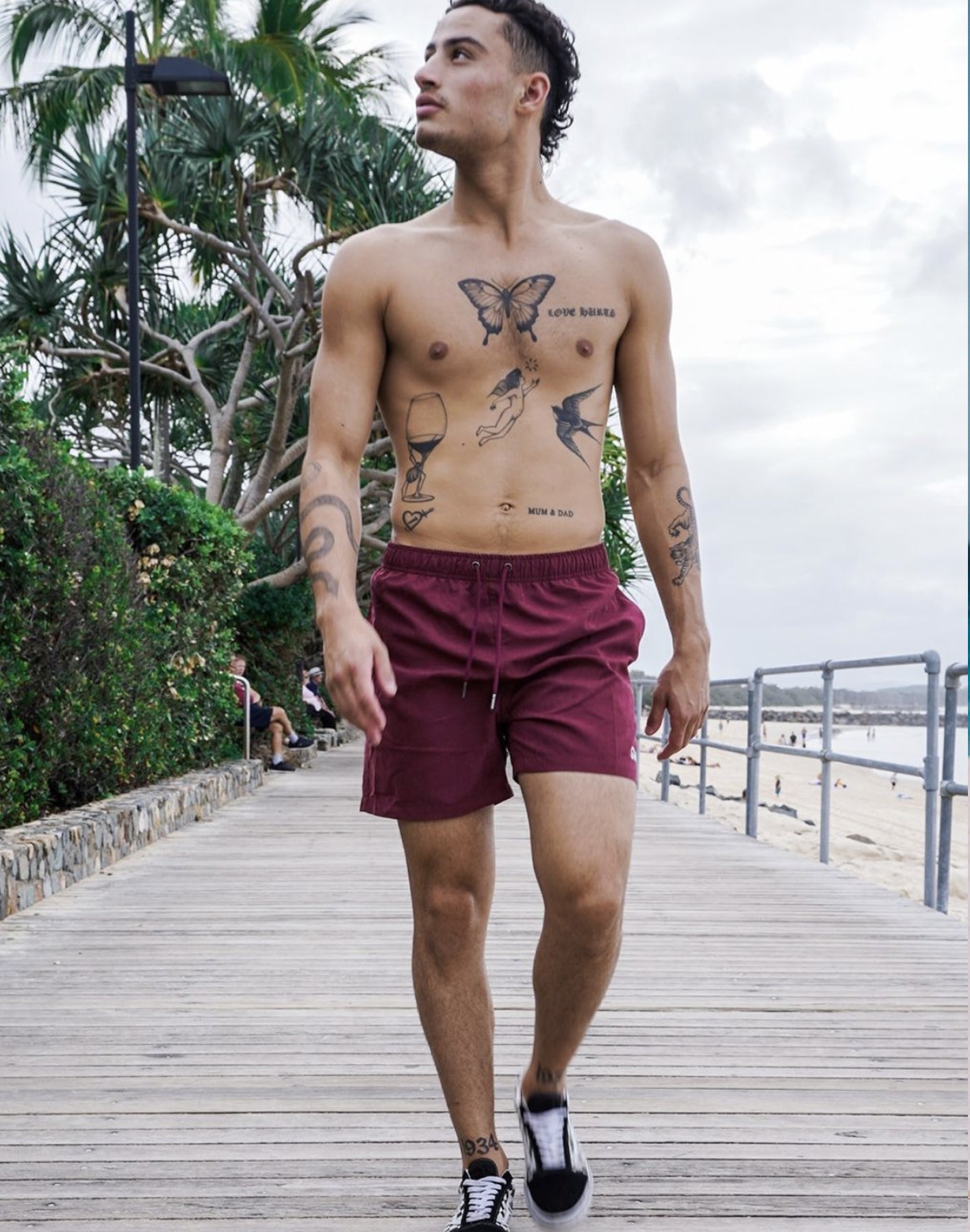 Eco-Friendly Burgundy  Men's Shorts by SevenC's Model Walking
