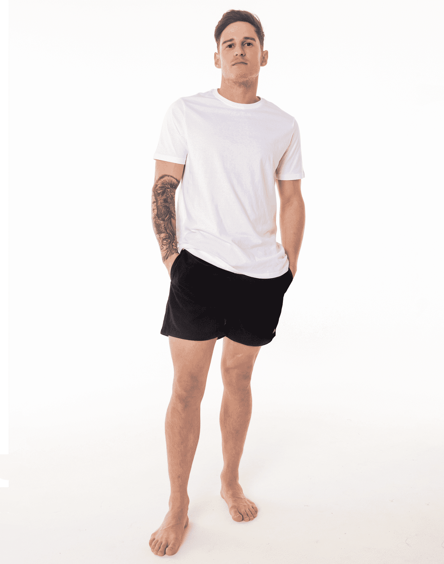 Model wearing Black SevenC's sustainable swim shorts