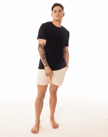 SevenCs Men's Recycled Polyester Shorts in Sand Stone - on Model with Black T-shirt View