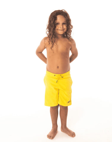 SevenC's Kids' Recycled Polyester Shorts in Yellow - Front View on model